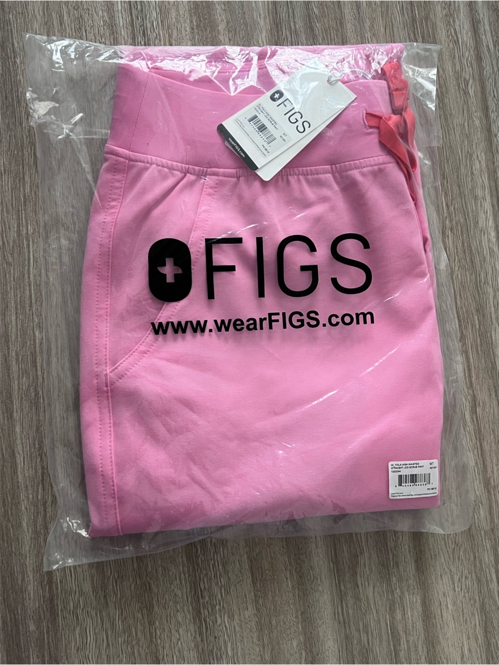 Figs Yola Scrub Pants in Sunrise Pink.